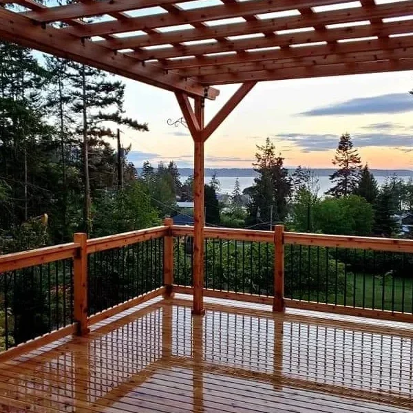 Cedar pergola on a deck overlooking a sunset