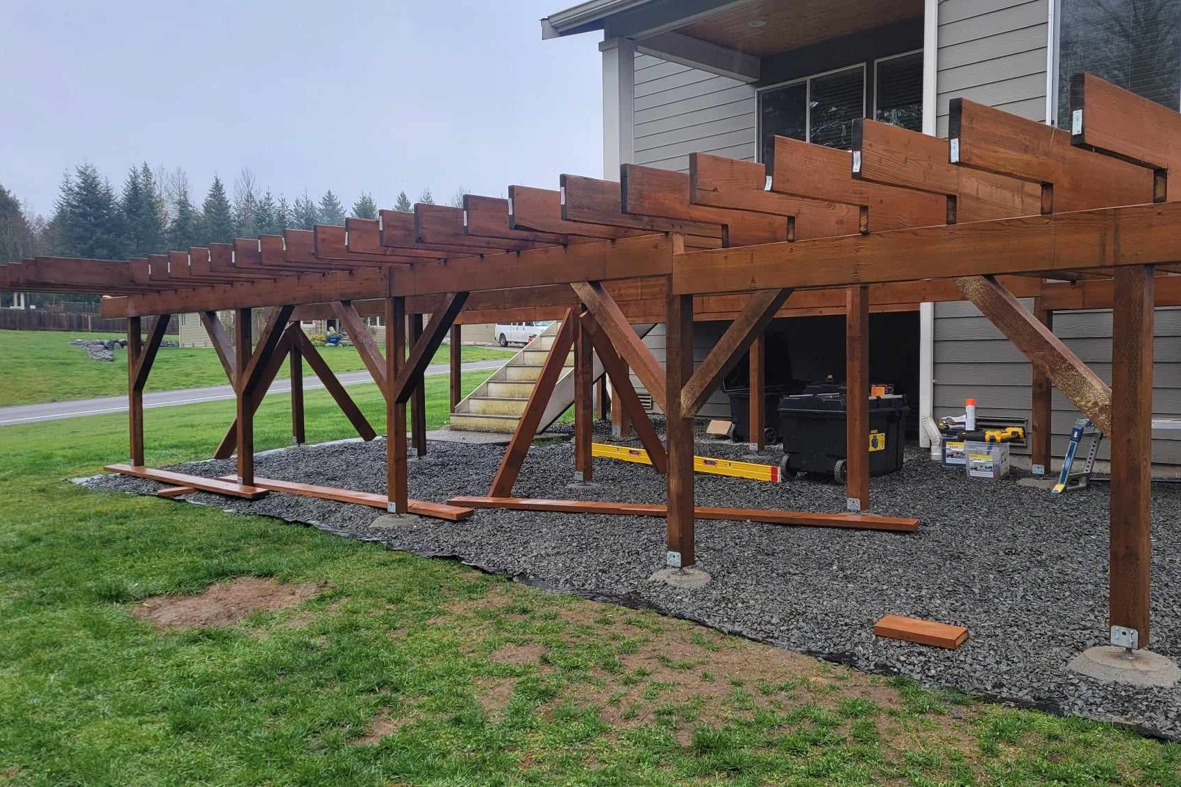 The framing of a large deck built using pressure treated hem-fir