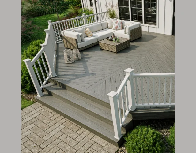 Deckorators Summit Decking in Glacier with white Classic Composite Rail An angled deck built with Deckorators Summit Decking in Glacier surrounded by a white Classic composite rail