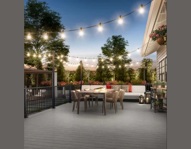 Deckorators Vista wood-plastic composite decking in Silverwood with ALX Aluminum Railing and Post Extensions